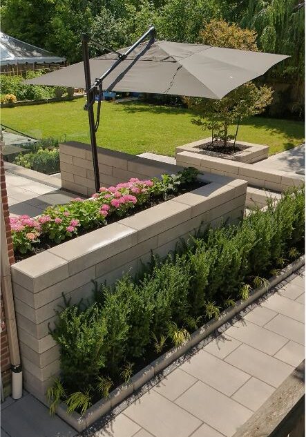 Custom Raised pre-cast stone Entertainment Area sectional with planting